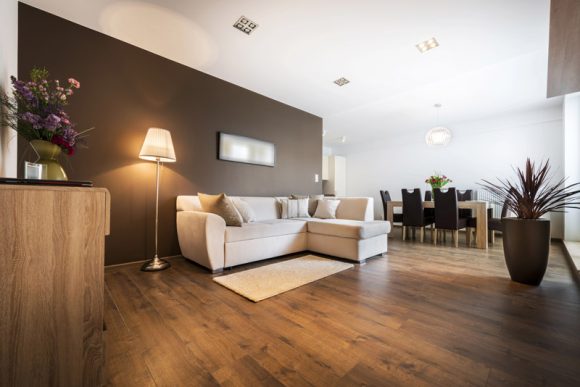 Large living room remodeled in Joliet with Luxury Vinyl Plank Flooring and New Paint